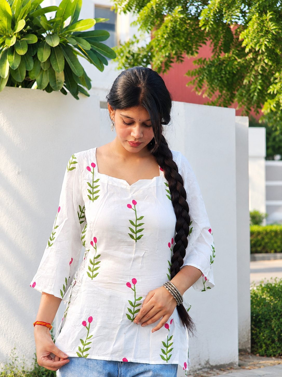 White Floral-Print Cotton kurti with green leaves, pink buds, and side tie-up detailing